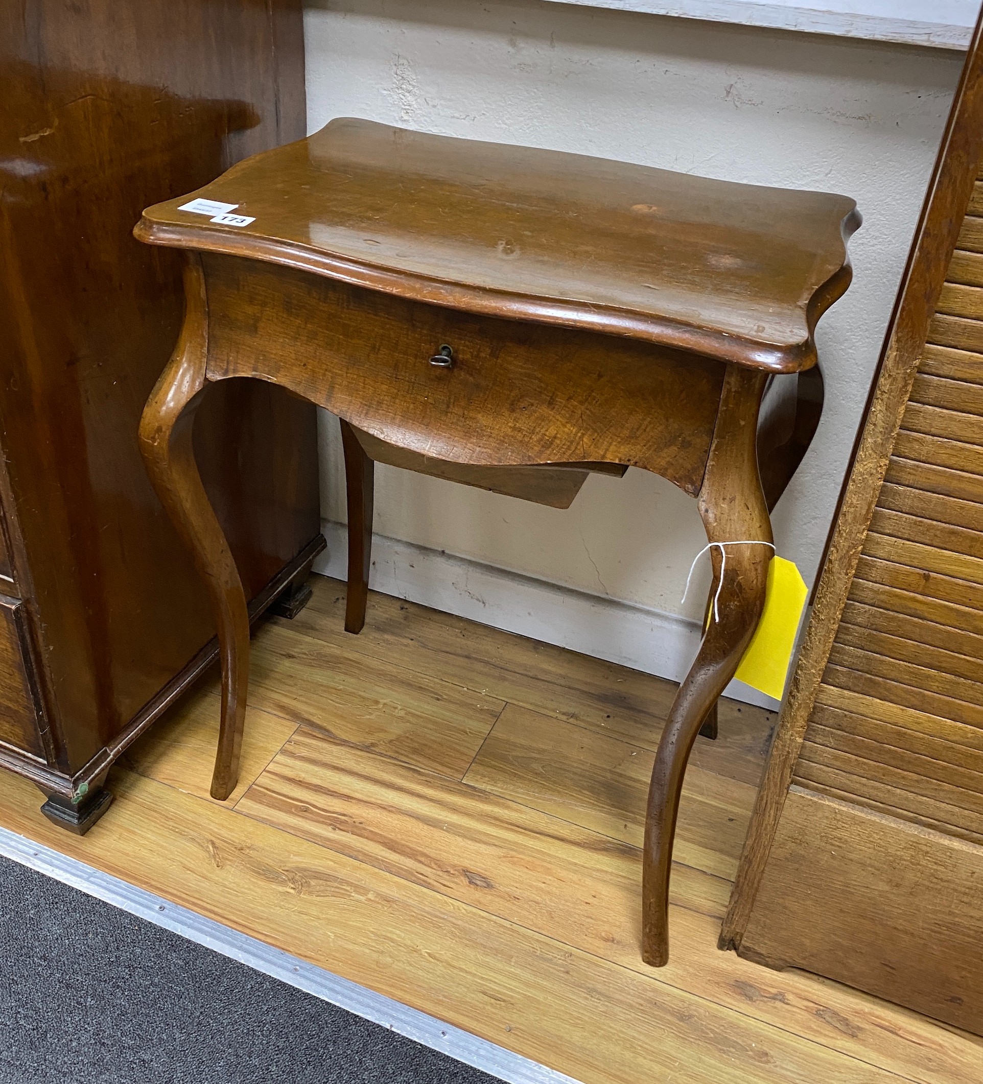 A 19th century French serpentine fronted work table, fitted with a single drawer, width 56cm, depth 40cm, height 71cm